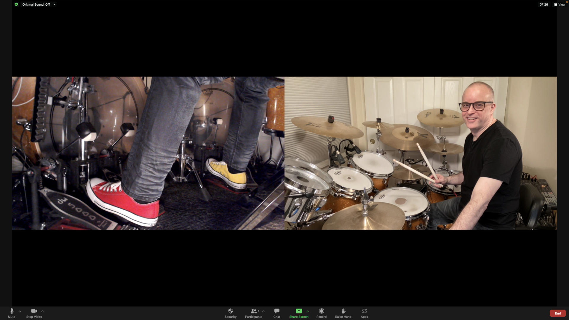 Side-by-side cameras with drumset and feet.
